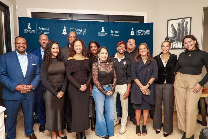 The full Aequitai team and advisory board gathered in front of a Howard University School of Law backdrop.